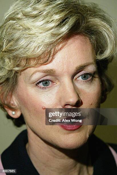 Michigan State Governor Jennifer Granholm answers questions from the media during a news conference February 23, 2004 after a meeting with President...