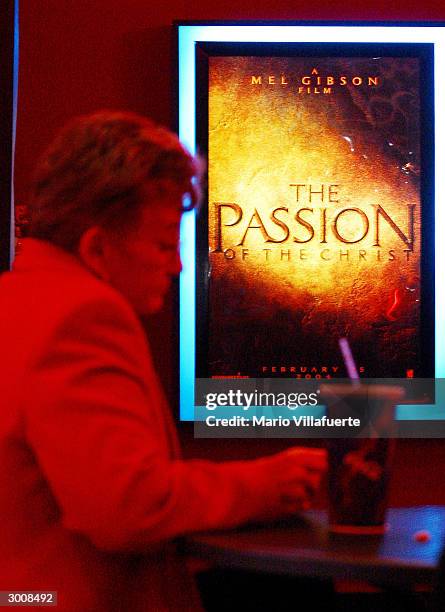 The Passion of the Christ" movie poster can be seen hanging in a Regal Cinema movie theater February 23, 2004 in Bossier City, Louisiana. 337 members...