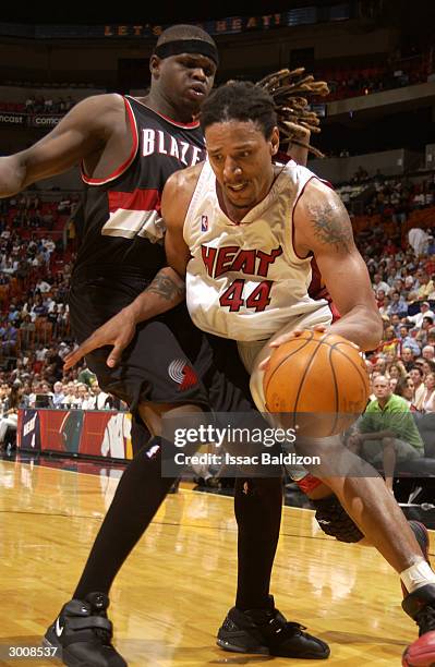 Brian Grant of the Miami Heat drives against Zach Randolph of the Portland Trail Blazers during NBA action on February 23, 2004 at American Airlines...