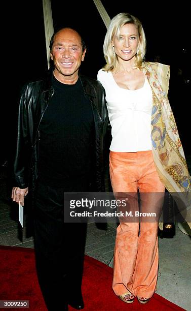 Recording artist Paul Anka and guest attend the film premiere of "Twisted" on February 23, 2004 at Paramount Pictures, in Hollywood, California.