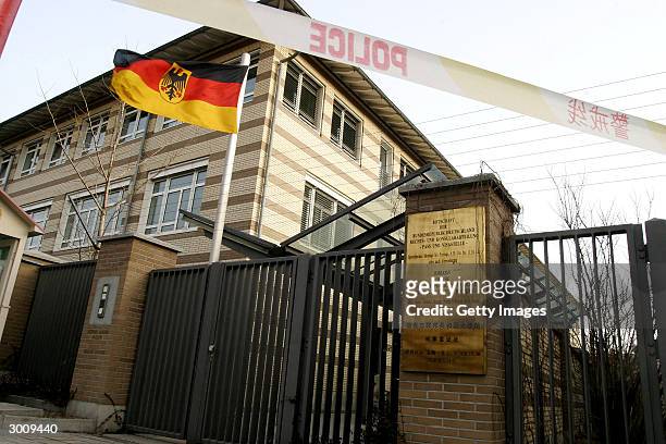 Police tape seals off the German Embassy after several suspected asylum seekers were transfered there February 24, 2004 having forced their way into...