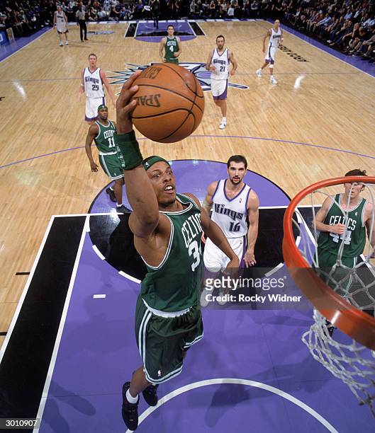 Paul Pierce of the Boston Celtics goes in for a dunk during the game against the Sacramento Kings at Arco Arena on February 17, 2004 in Sacramento,...