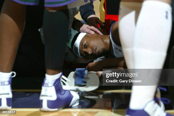 Ford of the Milwaukee Bucks is tended by paramedics after an injury forces him from the game against the Minnesota Timberwolves on February 24, 2004...