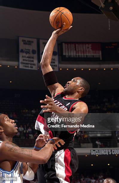 Shareef Abdur-Rahim of the Portland Trail Blazers shoots over Tracy McGrady of the Orlando Magic on February 24, 2004 at TD Waterhouse Centre in...