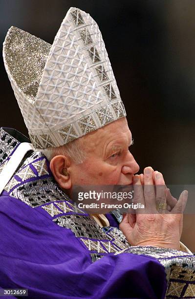 Pope John Paul II attends the Blessing and Imposition of the Ashes at St. Peters Basilica during the Ash Wednesday Service on February 25, 2004 in...