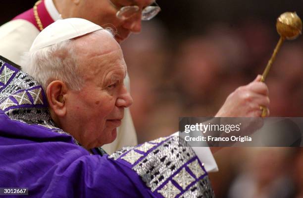 Pope John Paul II is seen blessing the Ashes at St. Peters Basilica during the Ash Wednesday Service on February 25, 2004 in the Vatican City. Ash...