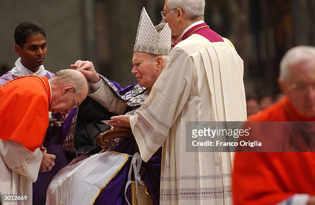 Pope John Paul II gives his Imposition of the Ashes at St. Peters Basilica during the Ash Wednesday Service on February 25, 2004 in the Vatican City....