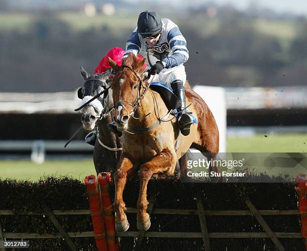 Jockey Tony McCoy comes over the last fence on Jardin Fleuri on his way to winning his first race on his comeback during The Corve Novices Selling...