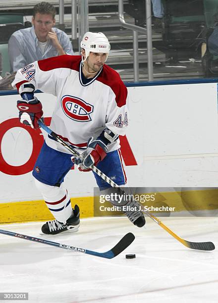 Defender Sheldon Souray of the Montreal Canadiens controls the puck against the Florida Panthers during the game at the Office Depot Center on...