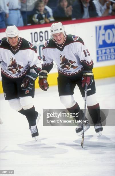 Right wing Shane Doan and defenseman Gerald Diduck of the Phoenix Coyotes in action during a game against the Dallas Stars at the America West Arena...