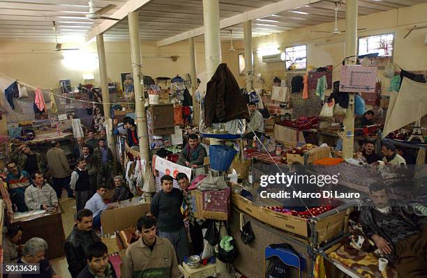 Ninety convicted Iraqi prisoners occupy a prison cell, which measures 143 square yards , February 25, 2004 in the Kurdish town of Arbil, 220 miles...