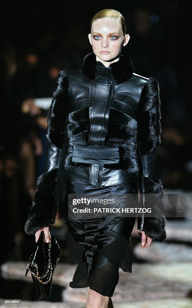 A model wears a creation as part of US d