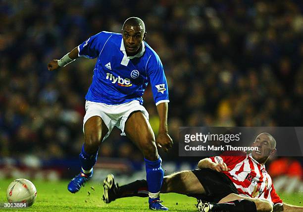 Clinton Morrison of Birmingham City avoids Stephen Wright of Sunderland during the FA Cup Fifth Round Replay match between Birmingham City and...