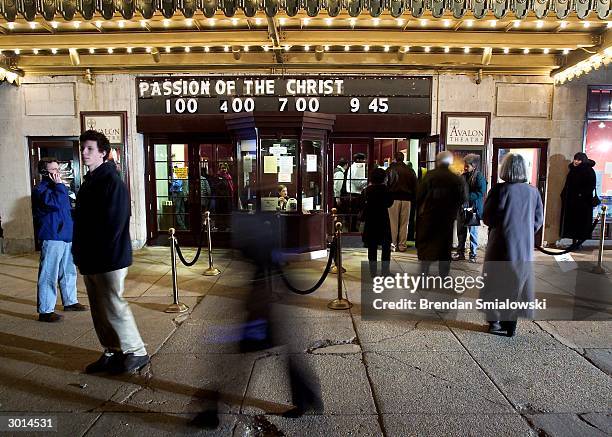 Moviegoers enter the Avalon Theater for the premiere of Mel Gibson's "The Passion of the Christ" February 25, 2004 in Washington, DC.