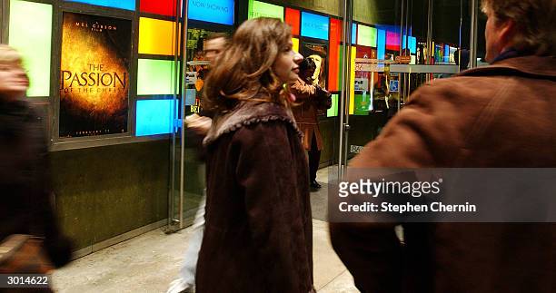 Movie-goers wait in line in front of a advertisement for Mel Gibson's The Passion of the Christ at a theater February 25, 2004 in New York CIty. 'The...