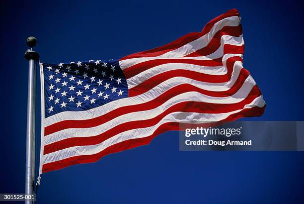 american flag ('stars and stripes') against blue sky, low angle view - us flagge stock-fotos und bilder