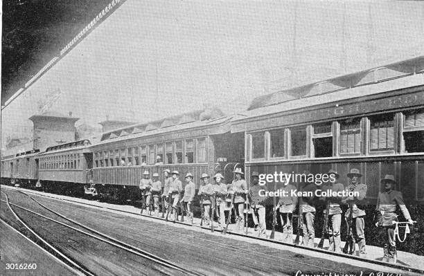 Group of soldiers stand near a railway carriage in an emergency camp during the Pullman Strike in Chicago, July 1894. The strike began when workers...