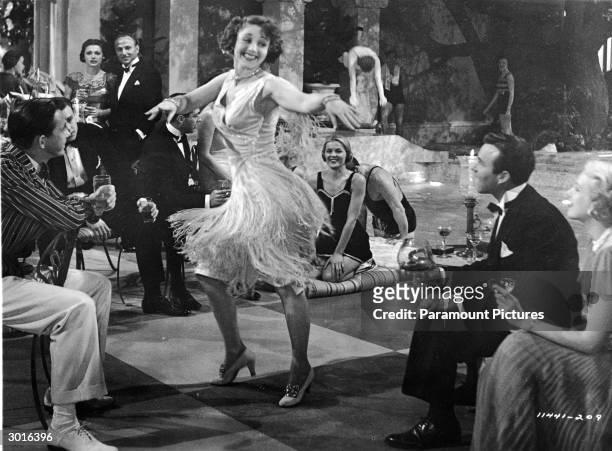 An unidentified woman wearing a 'flapper'- style skirt dances at a party in a still from the film, 'The Great Gatsby,' directed by Elliott Nugent,...