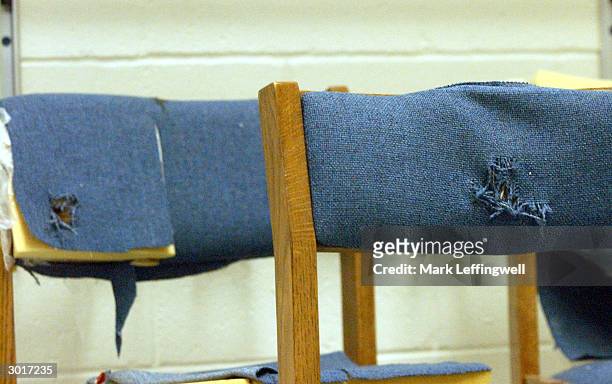 Chairs with bullet holes in the seat backs taken from Columbine High School are shown on display at the Jefferson County Fairgrounds February 26,...