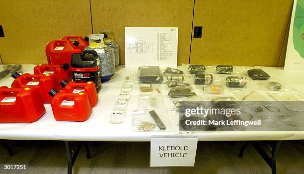 Gasoline canisters, a propane tank, bleach and homemade weapons collected from Dylan Klebold's vehicle are shown on display at the Jefferson County...