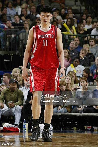 Yao Ming of the Houston Rockets on the court during the game against the Dallas Mavericks on February 21, 2004 at American Airlines Center in Dallas,...