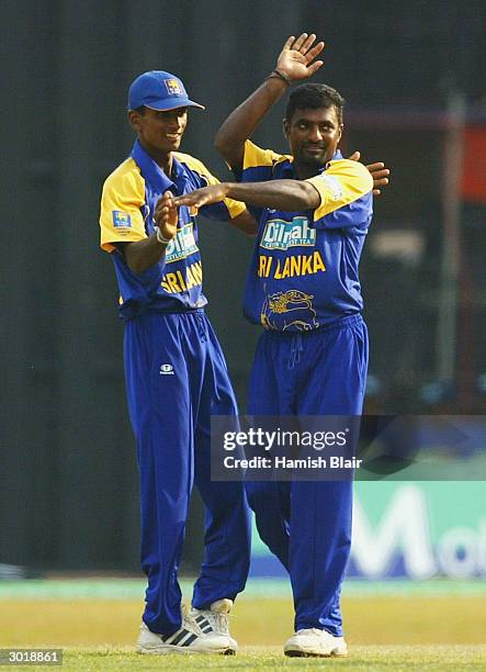 Muttiah Muralitharan of Sri Lanka celebrates the wicket of Andrew Symonds of Australia during the One Day International between Sri Lanka and...