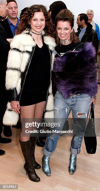 Actresses Antonella Elia and Sabrina Bertaccini attend the opening reception of Andy Warhol and Helmut Newton's work on February 26, 2004 at Gagosian...