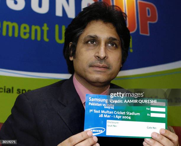 Pakistan Cricket Board Chief Executive Ramiz Raja shows a specimen of a ticket for next month's cricket series between Pakistan and India at a press...