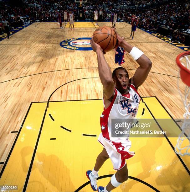 Kobe Bryant of the Western Conference All-Stars dunks against the Eastern Conference All-Stars during the 2004 All-Star Game on February 15, 2004 at...