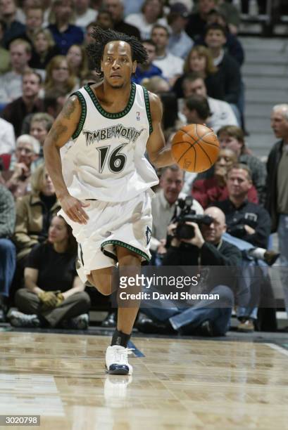 Troy Hudson of the Minnesota Timberwolves drives during the game against the San Antonio Spurs at Target Center on February 22, 2004 in Minneapolis,...