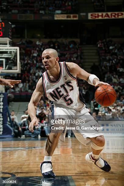 Jason Kidd of the New Jersey Nets moves the ball during the game against the New Orleans Hornets on February 21, 2004 at Continental Airlines Area in...