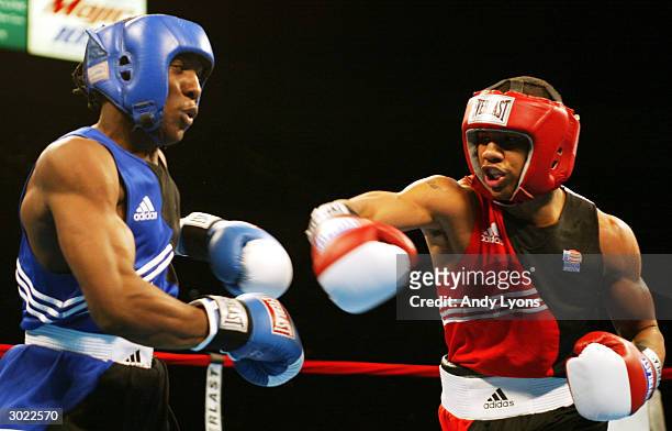 Andre Dirrell of Flint, Michigan lands a punch in his middleweight match against Clarence Joseph during the 2004 Olympic Box-Offs at the Cleveland...