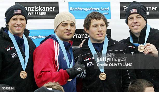 Team 1 of the US with Steve Mesler, Bill Schuffenahuer, Pavle Jovanovic and Todd Hays display their bronze medals on the podium of the bobsleigh...