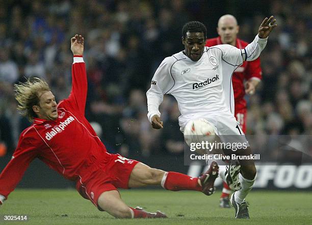 Jay Jay Okocha of Bolton Wanderers is challenged by Gaizka Mendieta of Middlesbrough during the Carling Cup Final match between Bolton Wanderers and...