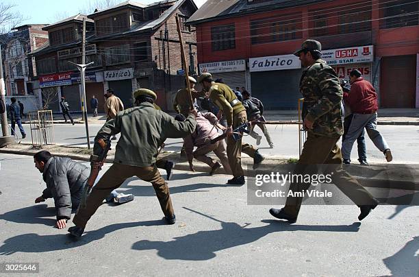 Indian police arrest and beat Kashmiri Shiite Muslims as they tried to celebrate the Muharram February 29, 2004 in Srinagar, India. Shiite Muslims...