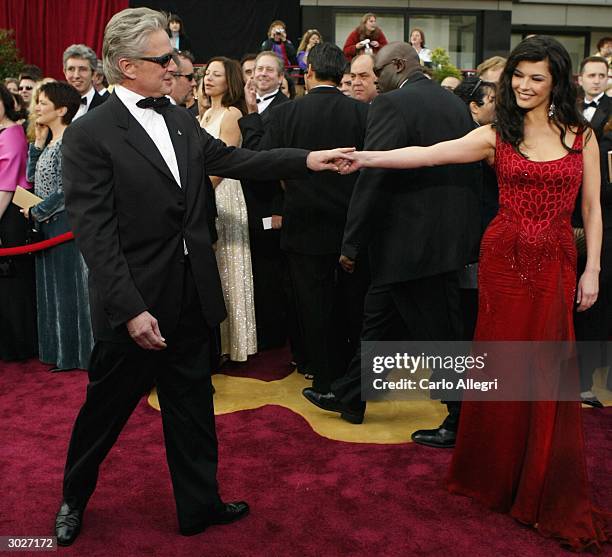 Actor Michael Douglas and wife Catherine Zeta-Jones attend the 76th Annual Academy Awards at the Kodak Theater on February 29, 2004 in Hollywood,...