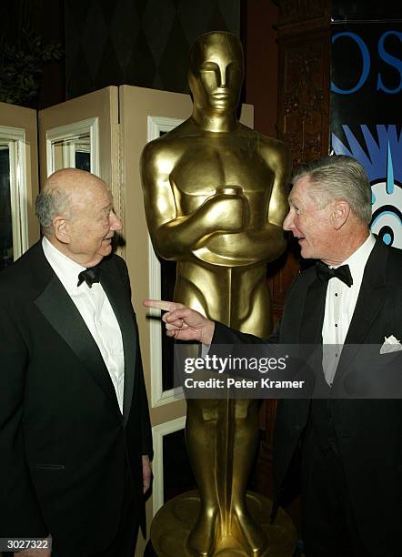 Former New York City Mayor Ed Koch and producer Robert Rehme attend the AMPAS Official Oscar Night Celebration at Le Cirque February 29, 2004 in New...