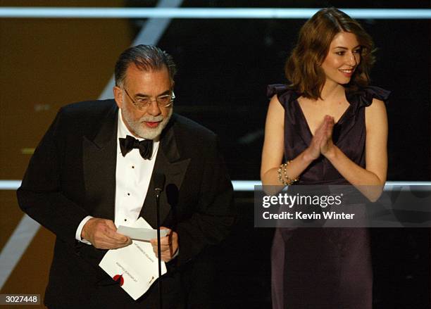 Director Sofia Coppola stands next to her father Francis Ford Coppola on stage during the 76th Annual Academy Awards at the Kodak Theater on February...
