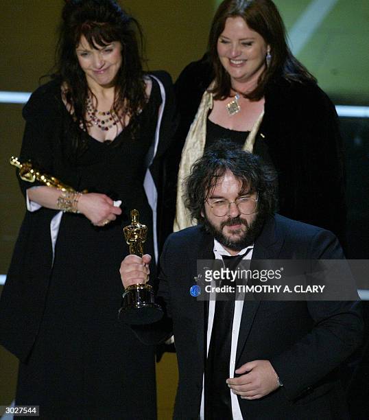 United States: Director Peter Jackson accepts the Oscar for Best Adapted Screenplay with co-writers Fran Walsh and Phillippa Boyens during the 76th...
