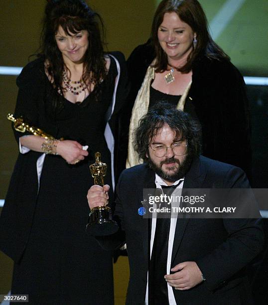 United States: Director Peter Jackson accepts the Oscar for Best Adapted Screenplay with co-writers Fran Walsh and Phillippa Boyens during the 76th...