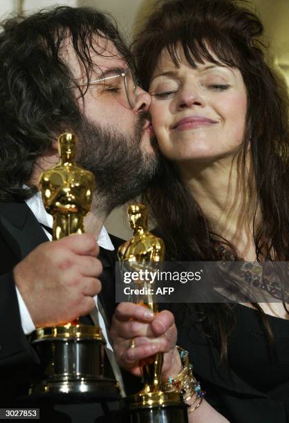 United States: Fran Walsh is kissed by director Peter Jackson as they pose with their Oscar for Best Adapted Screenplay at the 76th Academy Awards...