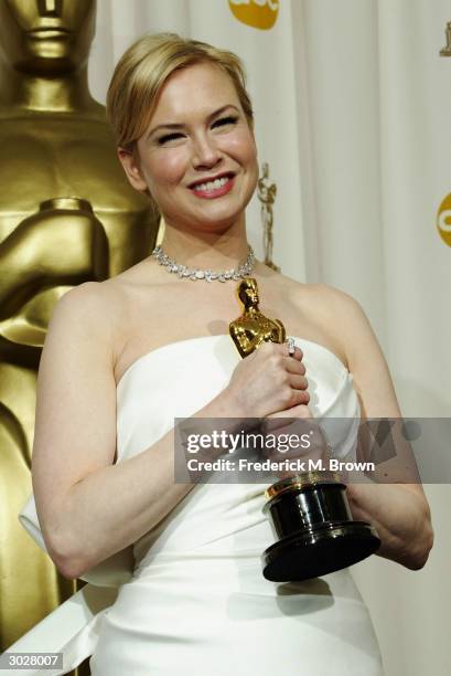 Actress Renee Zellweger poses with her Oscar for Best Supporting Actress during the 76th Annual Academy Awards at the Kodak Theater on February 29,...