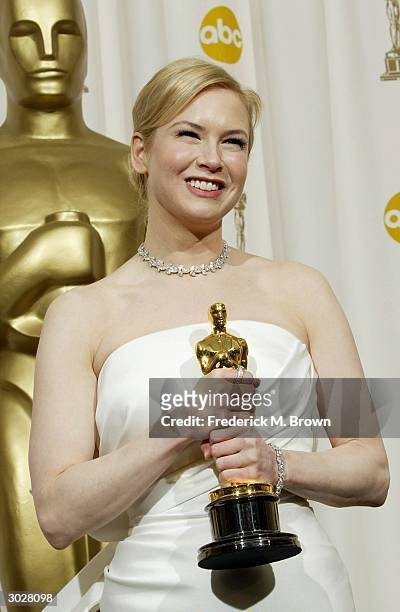 Actress Renee Zellweger poses with her Oscar for Best Supporting Actress during the 76th Annual Academy Awards at the Kodak Theater on February 29,...