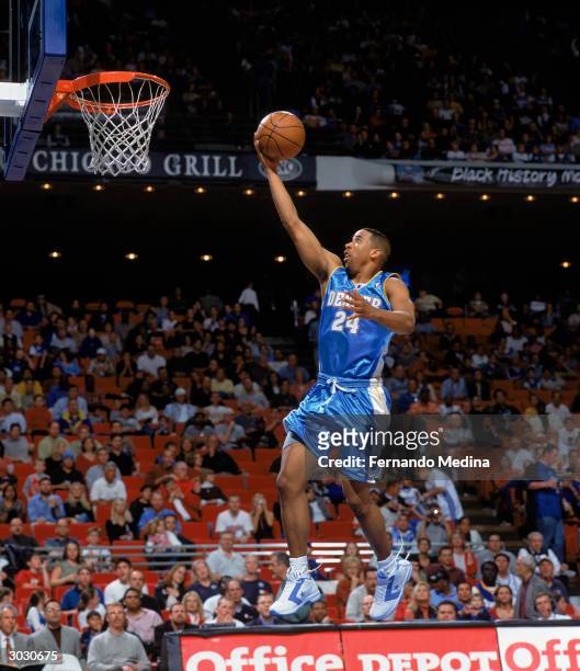 Andre Miller of the Denver Nuggets lays up a shot against the Orlando Magic during the game on February 20, 2004 at TD Waterhouse Centre in Orlando,...