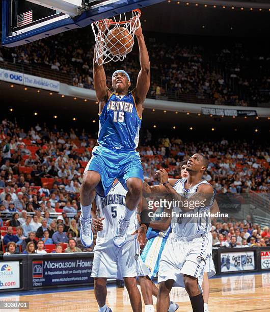 Carmelo Anthony of the Denver Nuggets dunks against the Orlando Magic during the game on February 20, 2004 at TD Waterhouse Centre in Orlando,...