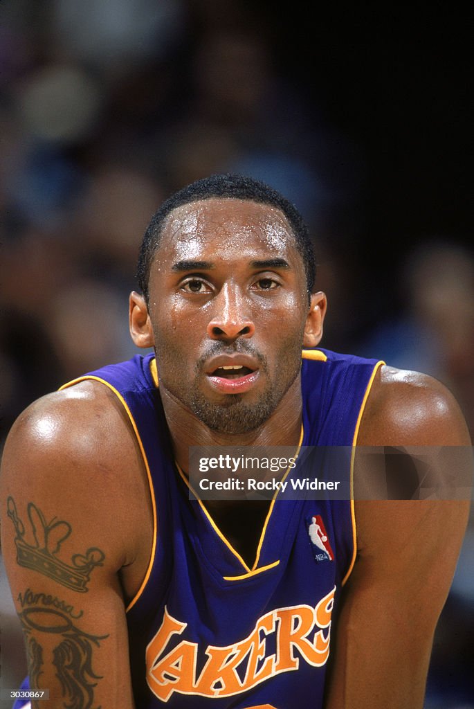 Kobe Bryant of the Los Angeles Lakers looks on during a break in game