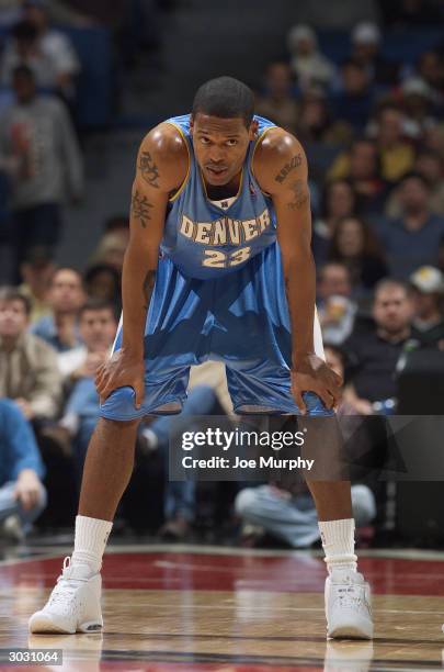 Marcus Camby of the Denver Nuggets stands on the court during the game against the Memphis Grizzlies at The Pyramid on February 23, 2004 in Memphis,...