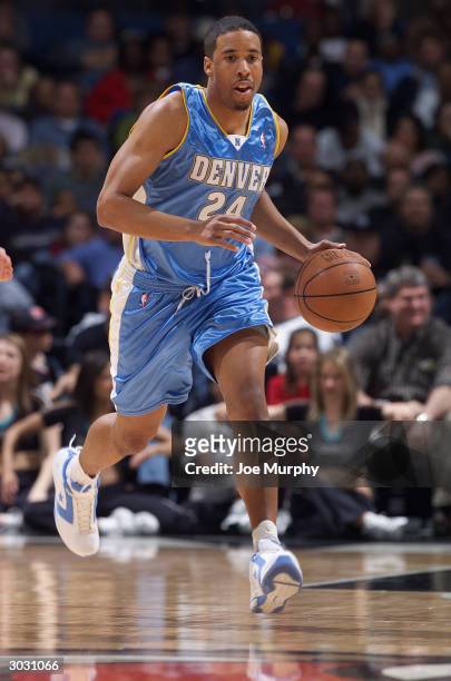 Andre Miller of the Denver Nuggets brings the ball upcourt during the game against the Memphis Grizzlies at The Pyramid on February 23, 2004 in...