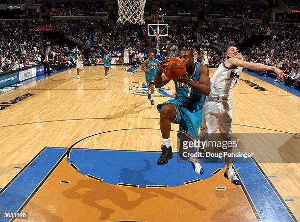 Baron Davis of the New Orleans Hornets drives for a shot attempt past the defense of Steve Blake of the Washington Wizards during NBA action on March...