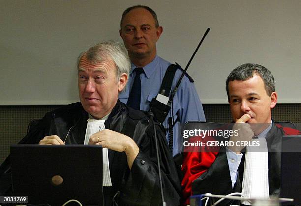 The king's prosecutor, Michel Bourlet , and Attorney-General Jean-Baptiste Andries are pictured 02 March 2004 in the courthouse of the southeastern...